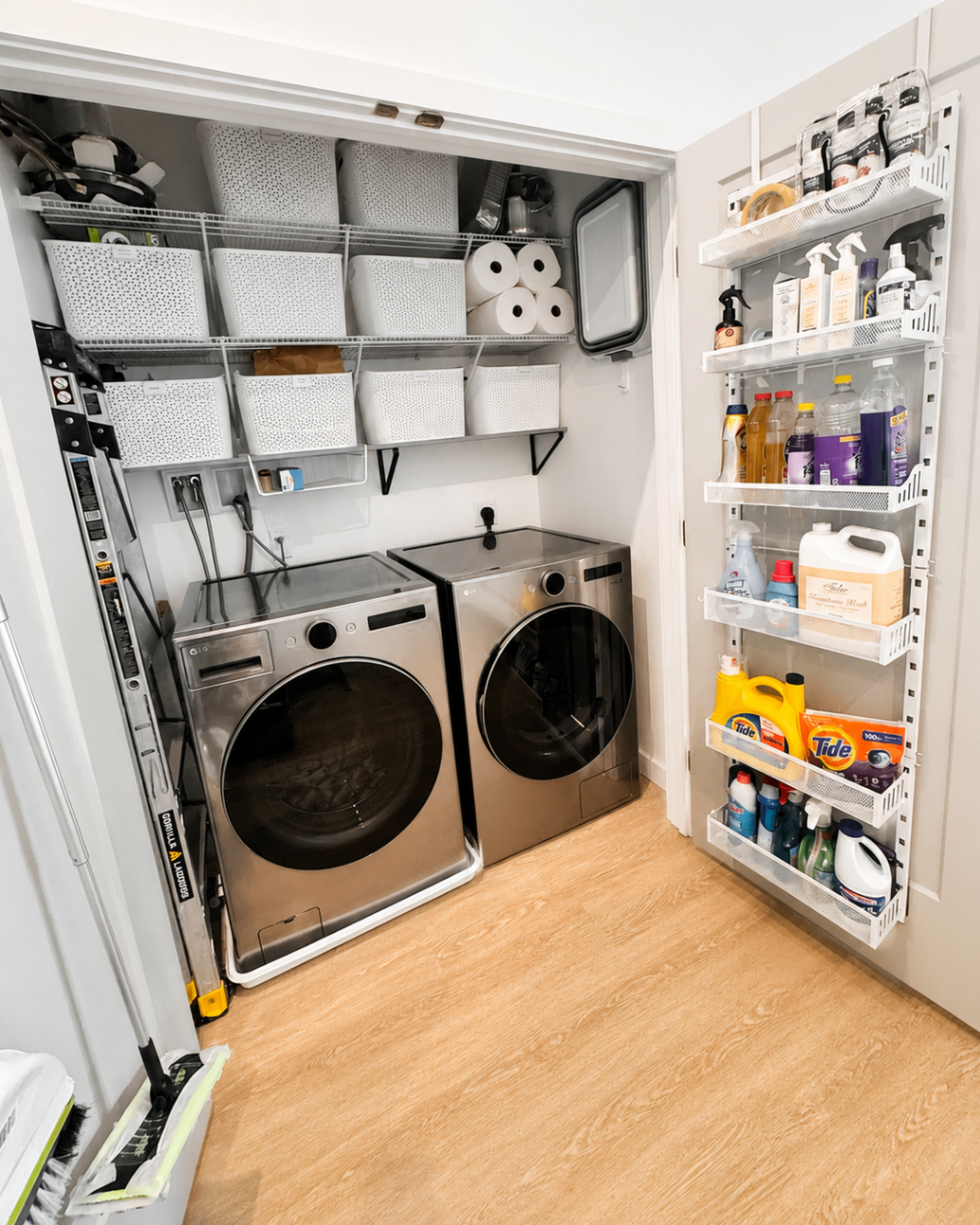 Organized laundry room with shelves, baskets, and neatly arranged products.